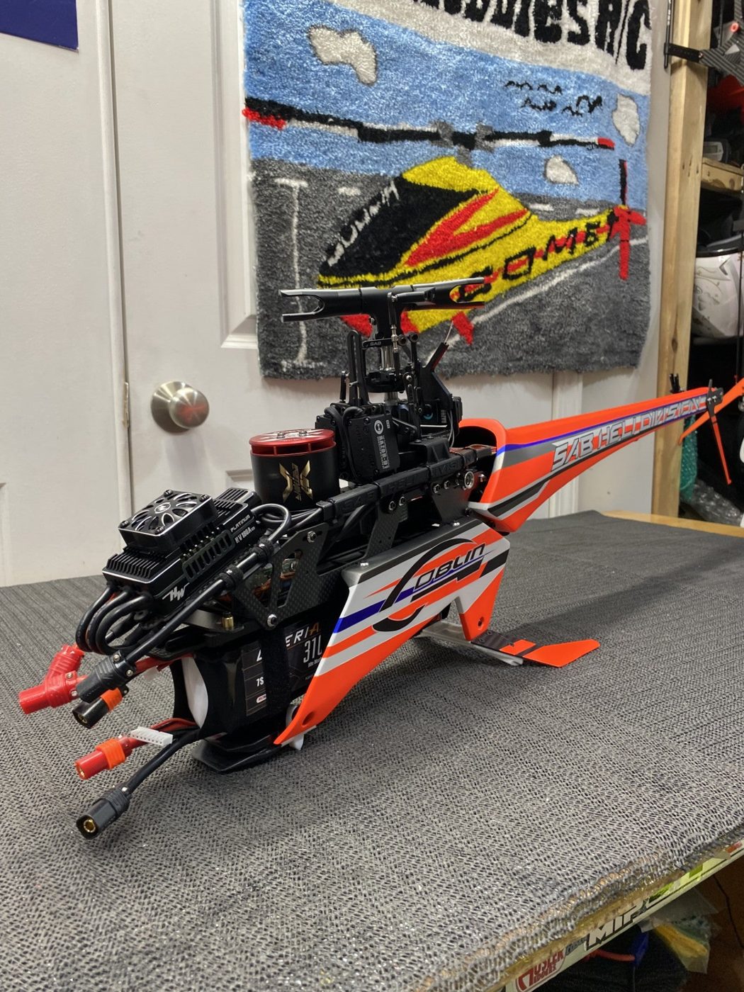 Finished orange and blue helicopter on the bench